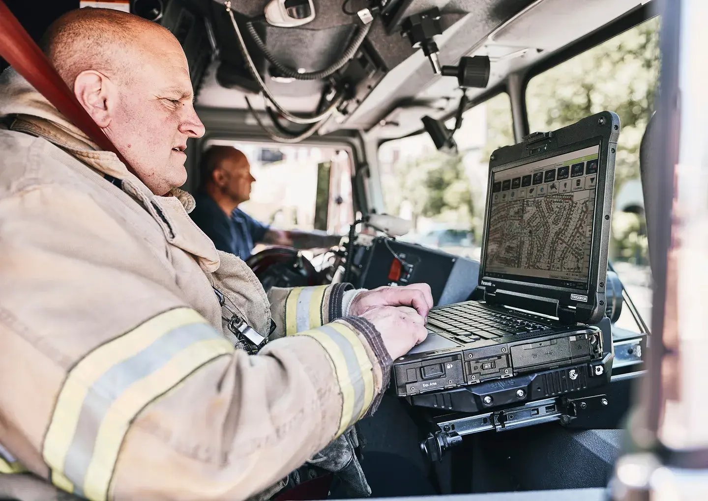 inside-fire-truck-firefighter-on-laptop