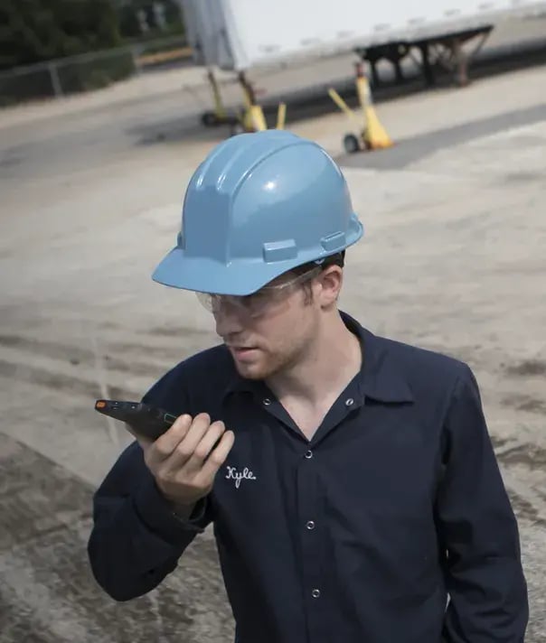 man-in-hard-hat-with-two-way-radio