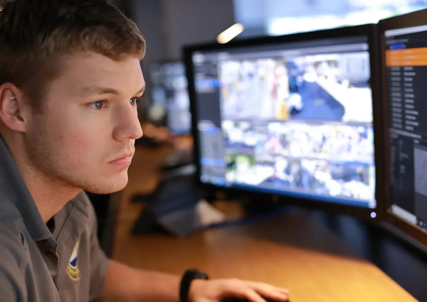 man-monitoring-security-camera-feeds