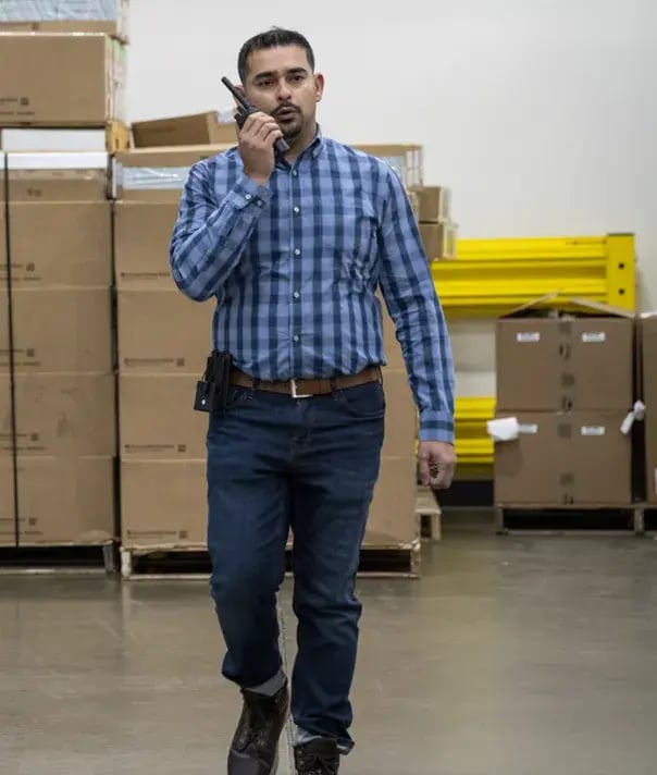 man-on-radio-in-warehouse