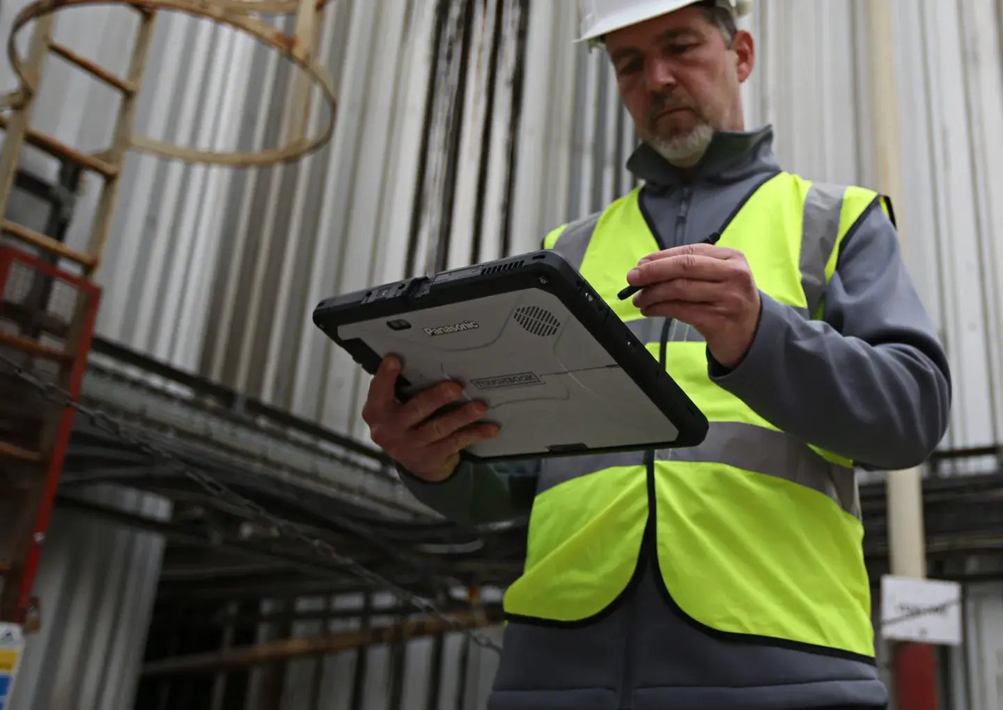 man-outside-on-tablet