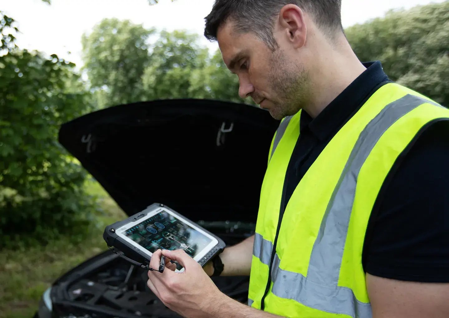 man-outside=on-tablet
