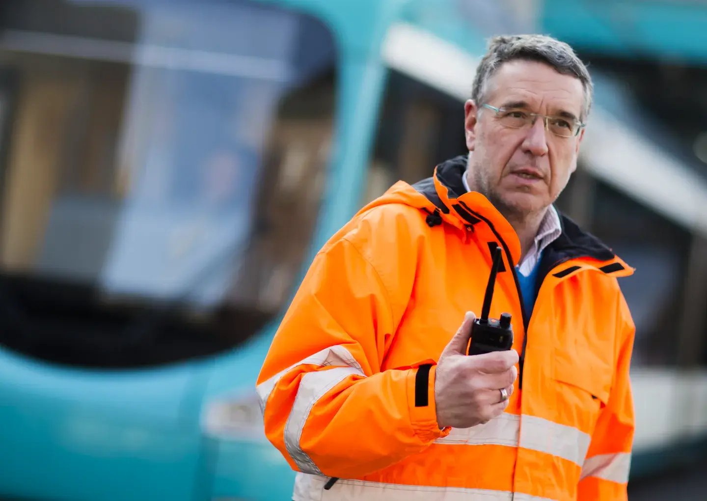 man-outside-in-jacket-with-radio