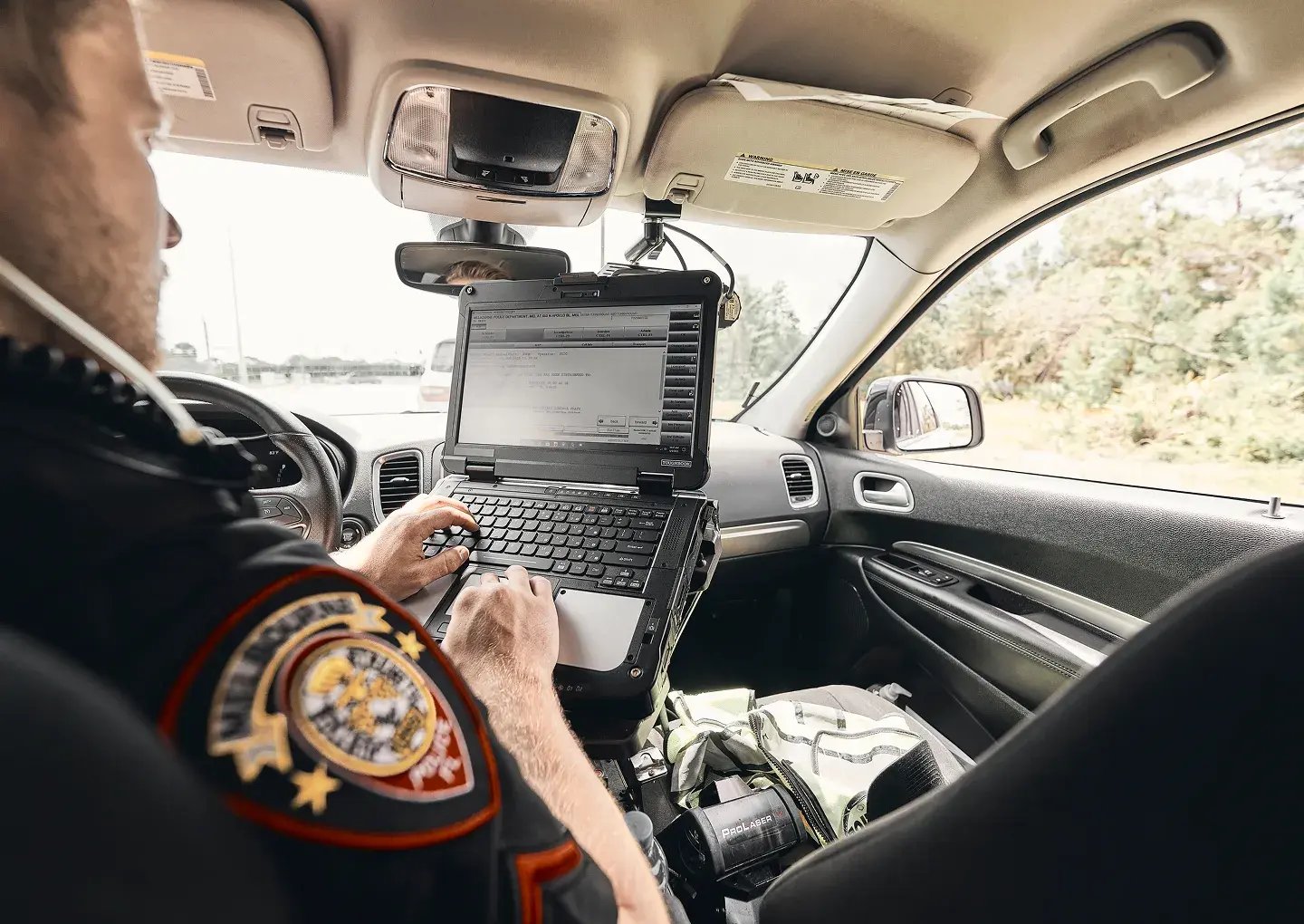 police-in-car-on-laptop