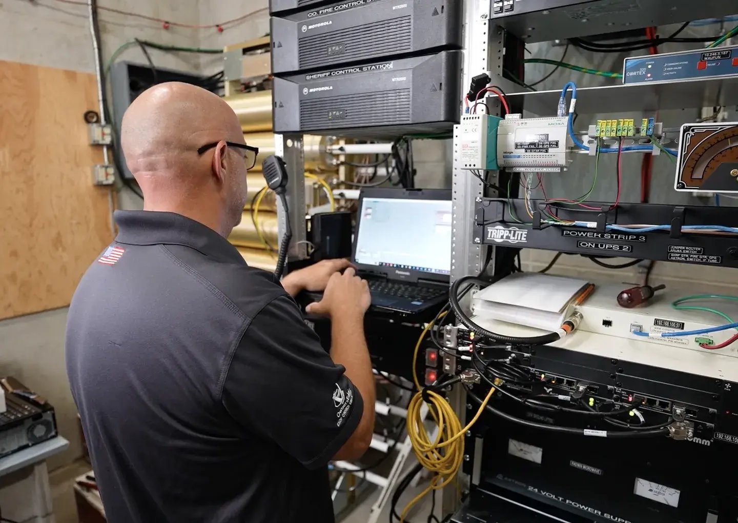 tech-working-on-laptop