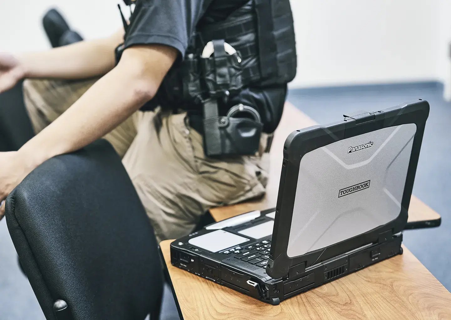 toughbook-on-table-next-to-a-police-officer